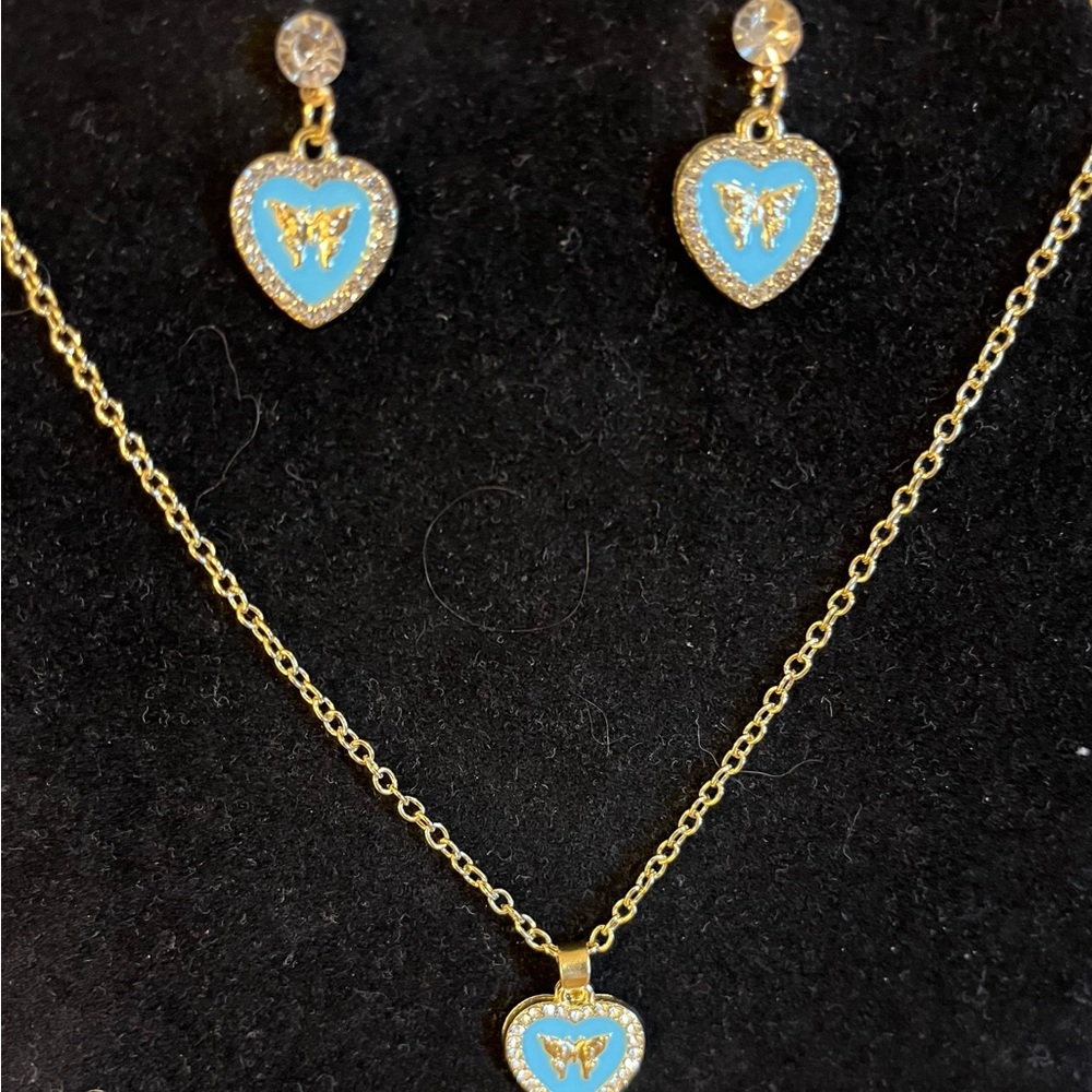 Blue butterfly heart necklace on gold tone with matching earrings 16”